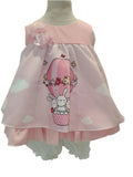 Peques pink baby girls dress with hot air balloon bunny print, floral accent, and ruffled hem, paired with white bloomers.