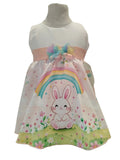 Peques girls white dress with rainbow bunny print, pastel pink sash, and floral accents. Perfect for Easter.